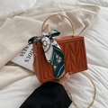 Caramel orange quilted box bag with silk scarf handle and gold chain strap detail - Brick Red