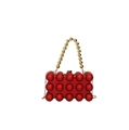 Detail of red acrylic eggshell evening bag with 3D sphere texture and gold bead handle - Red