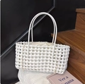Detail of white woven tote bag featuring a rectangular structure and drawstring liner - White