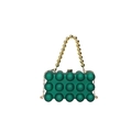 Detail of emerald green acrylic evening bag featuring unique 3D bubble texture and gold bead handle - Green