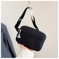 Detail of black nylon kids waist bag featuring multi-zipper layers and white zipper pulls - Black