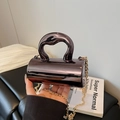 Mini gunmetal metallic cylinder evening bag with sculptural handle and gold chain - Gunmetal