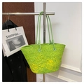 Detail of lime green woven tote bag with yellow gradient on a metal hanger - Apple Green