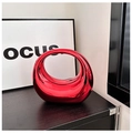 Close-up of bright red acrylic moon clutch with a modern hollow mirror finish design - Red