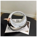 Close-up of a silver mirror finish acrylic evening clutch with an artistic ring handle - Silver