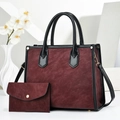 Detail of burgundy textured tote bag set with matching wallet and golden hardware - Wine Red