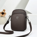 Dark coffee litchi grain small crossbody bag with silver logo on a white display - Coffee