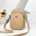 Brown lychee leather crossbody bag with dual zippers and circular hardware detail - Khaki