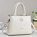 Fashionable creamy white pebble leather handbag for women with silver logo and crossbody strap - Off-white