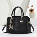 Chic black snakeskin embossed handbag for women with gold hardware and heart charm - Black