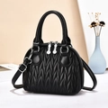 Chic black quilted bowling handbag with V-shaped stitching and detachable shoulder strap - Black