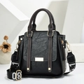 Detail of black vintage PU leather handbag with contrast stitching and wide 08 strap - Black