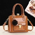 Elegant brown patent leather handbag with vintage metal frame and jewel clasp decoration - Earthy Yellow