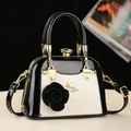 Chic black and white shell bag in patent leather with a rose charm and gold hardware - Beige