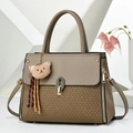 Detail of elegant beige handbag with knit texture, metal lock and cute bear charm - Dark Khaki