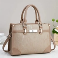 Detail of minimalist tote bag with two-tone panels, striped texture and silver metal lock - Khaki