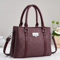 Deep burgundy large tote bag with vertical stripes, silver buckle, and shoulder strap - Red