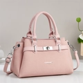 Elegant pink Saffiano leather handbag with silver twist lock and dual top handles - Pink