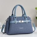 Detail of navy blue crossbody bag with silver twist lock and fashion leather texture - Blue