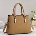 Retro tan canvas tote bag with brown leather handles shown in a minimal home setting - Khaki