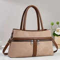 Detail of khaki suede handbag with double zippers, round handles and adjustable strap - Khaki