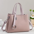 Elegant mauve tote bag with V-shaped texture and silver rings for stylish commuting - Pink