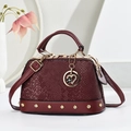 Elegant wine red snakeskin texture handbag with gold rivets and heart pendant - Wine Red