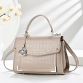 Chic beige crocodile embossed handbag with glossy finish and silver metal hardware details - Apricot