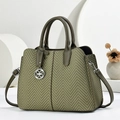 Olive green herringbone woven handbag with silver clover charm and adjustable shoulder strap - Green