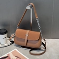 Macro detail of brown woven texture and smooth leather finish on a chic crossbody bag - Khaki/Earth Yellow