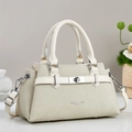 Close-up of beige handbag featuring twill texture fabric and silver metal lock details - Off White