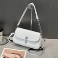 Detail of white woven texture on crossbody bag with silver rotating lock and chain strap - White