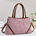 Retro dusty pink crossbody bag with brown handles and a spacious, elegant design - Pink