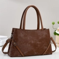 Retro brown leather tote bag with top handles and adjustable strap in a 45-degree view - Brown