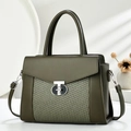 Olive green shoulder bag with woven leather panel and silver T-lock in a soft studio setting - Green