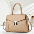 Detail of minimalist leather and woven patchwork shoulder bag with silver T-lock buckle - Khaki