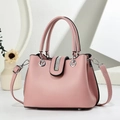 Elegant pink PU leather handbag for women featuring sparkling rhinestone details and top handles - Pink