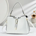 White structured tote bag with grid pattern texture and gold buckle on a light background - White
