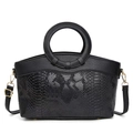 Elegante borsa vintage nera con trama a serpente e manici circolari dorati - Nero