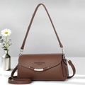 Brown lychee leather square bag detail with adjustable strap and metal hardware - Brown