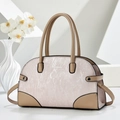 Pink knit underarm bag with tan leather trim and Fashion Bags print in a minimalist setting - Pink