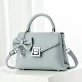 Elegant Morandi blue crossbody bag with lychee grain leather and pearl bow charm - Blue
