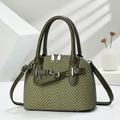 Vintage green herringbone fabric handbag with leather straps and metallic buckles - Green