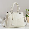 Minimalist beige tote bag with V-shaped stitching and silver hardware in a 45-degree view - Off-white