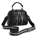 Detail of black pebbled leather handbag with wide woven geometric patterned shoulder strap - Black