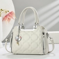 Elegant off-white quilted handbag with floral patterns and pearl sea-inspired charms - White
