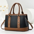 Detail of contrast color large tote bag with lychee texture and gold metal eyelets - Black