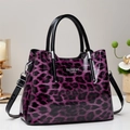 Purple leopard print tote bag in glossy patent leather with top handles and shoulder strap - Purple