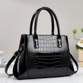 Fashionable black crocodile embossed tote bag with gold hardware and shoulder strap - Black