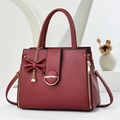 Classic burgundy lychee pattern shoulder bag with a bow charm and golden metal hardware - Wine Red